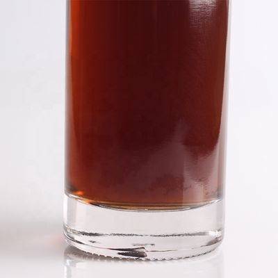 Garrafa de vidro de tequila gravada de 750 ml por litro com forma redonda e tipo de vedação de cortiça