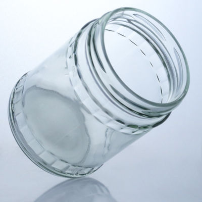 Garrafa de vidro de pedra redonda transparente para produção e distribuição de alimentos