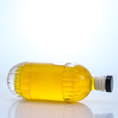 Garrafa de vidro para bebidas industriais com desenho em relevo e forma redonda de cortiça